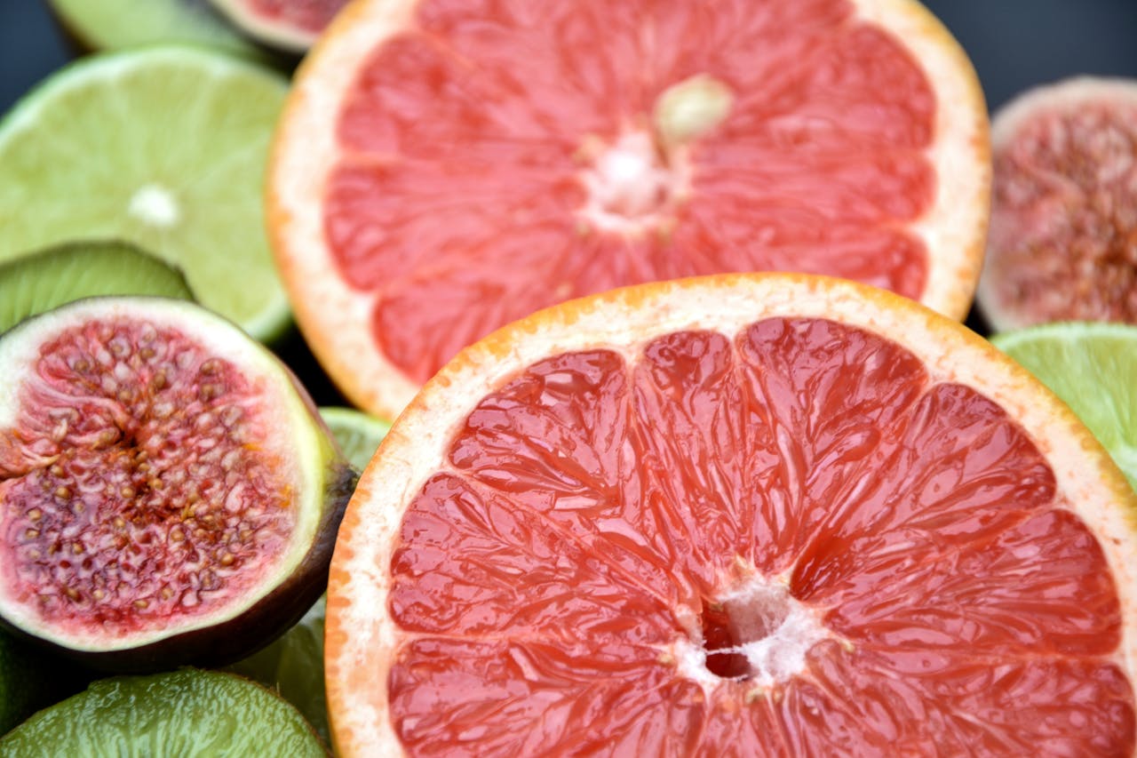 gallery-1 Vibrant close-up of fresh citrus and figs highlighting juicy textures and colors.